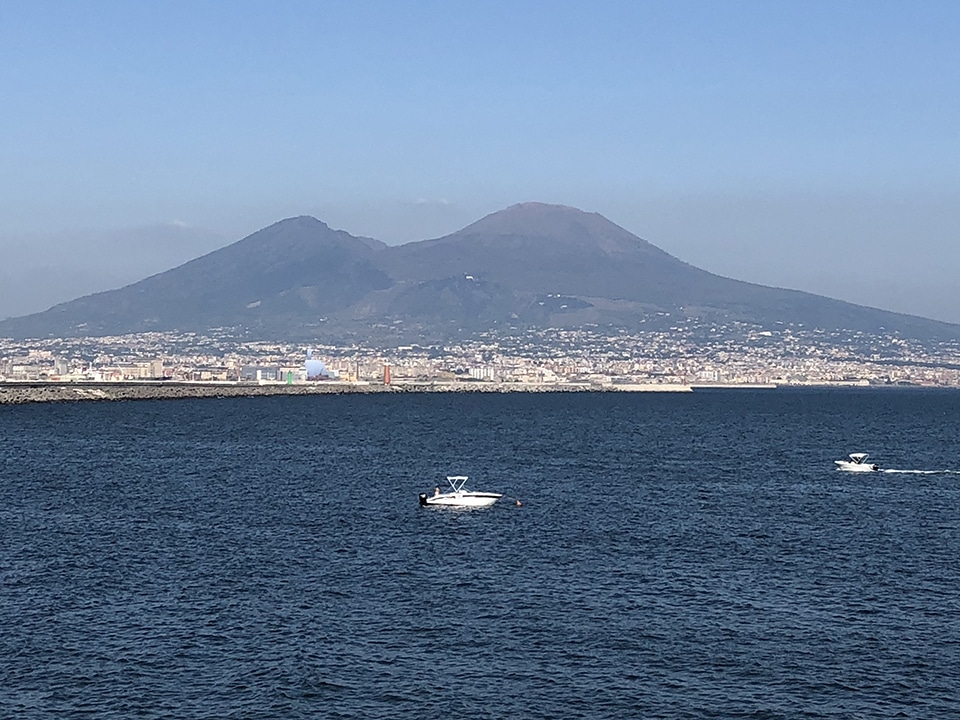 13 amazing things to do in Naples, Italy. A view out across the bay towards Mount Vesuvius.