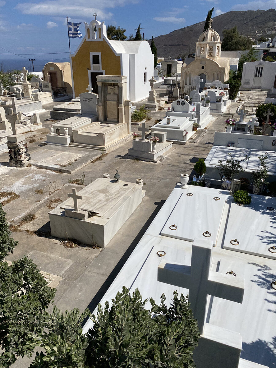 A beautiful cemetery and a view of Oia.
