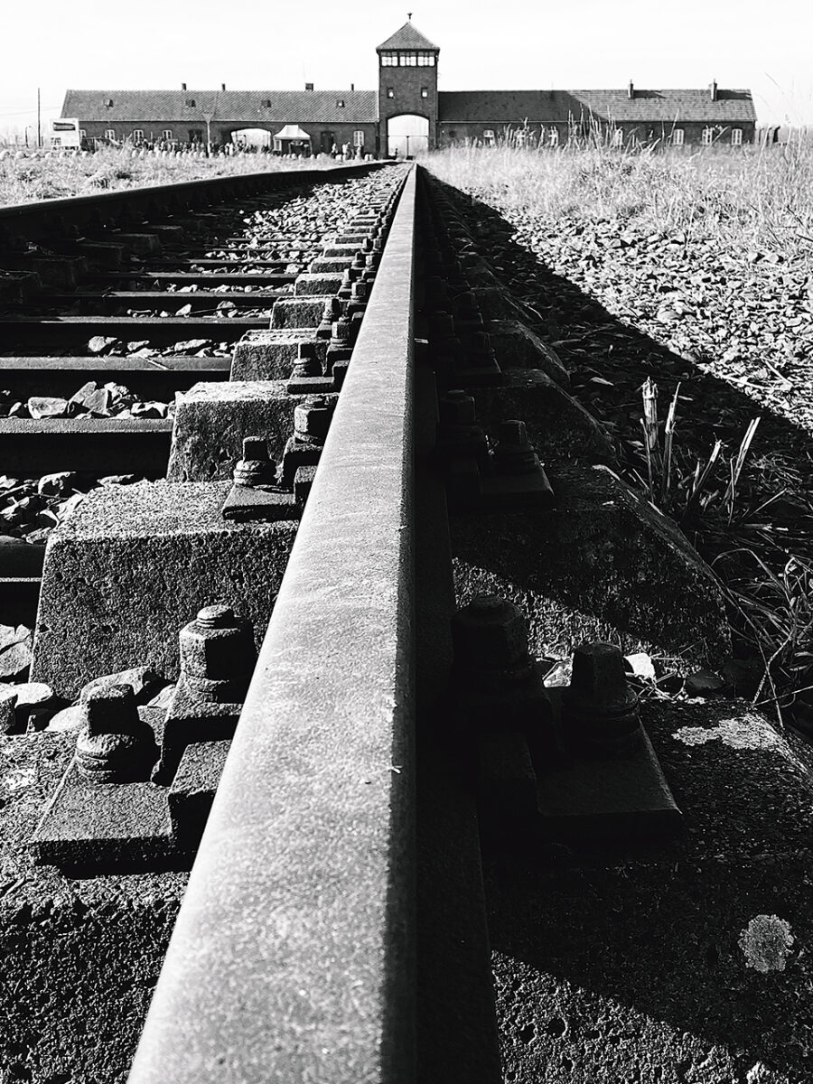 Train tracks and gatehouse of Auschwitz II-Birkenau. How to visit Auschwitz from Kraków.