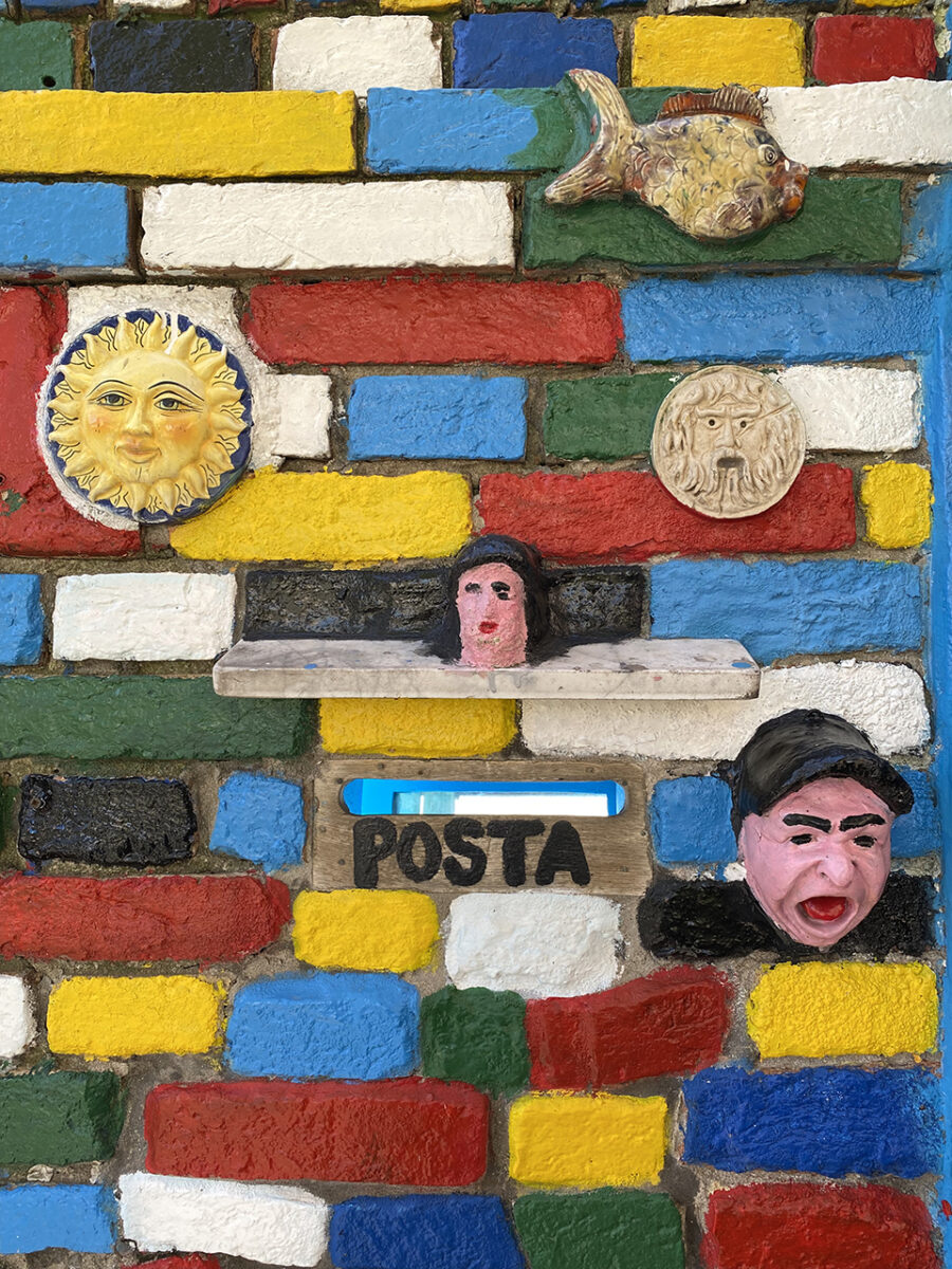 Brightly coloured brick wall, Burano.