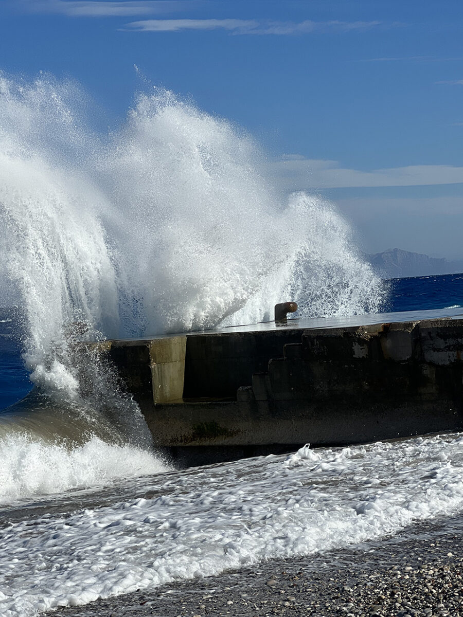 Dramatic waves crashing on Akti Kanari beach, Rhodes, Greece.