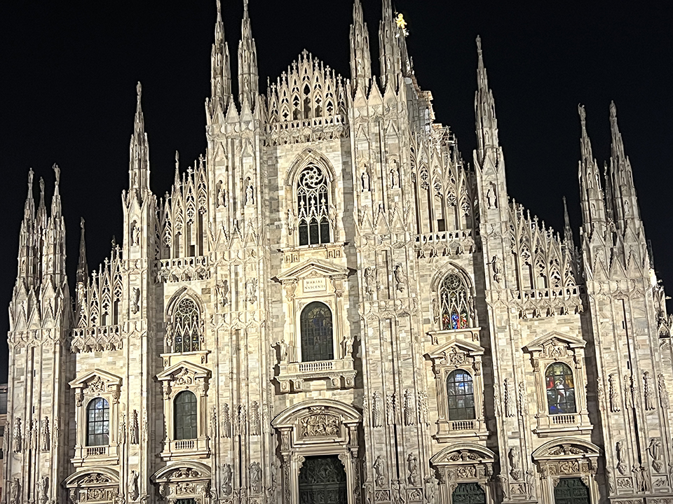 Admire the Duomo di Milano at night.