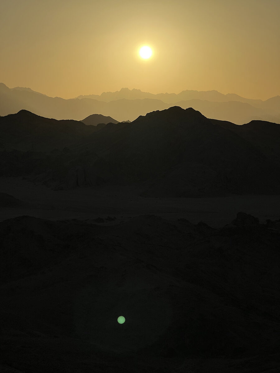 The sun sets over the desert mountains, Hurghada, Egypt.