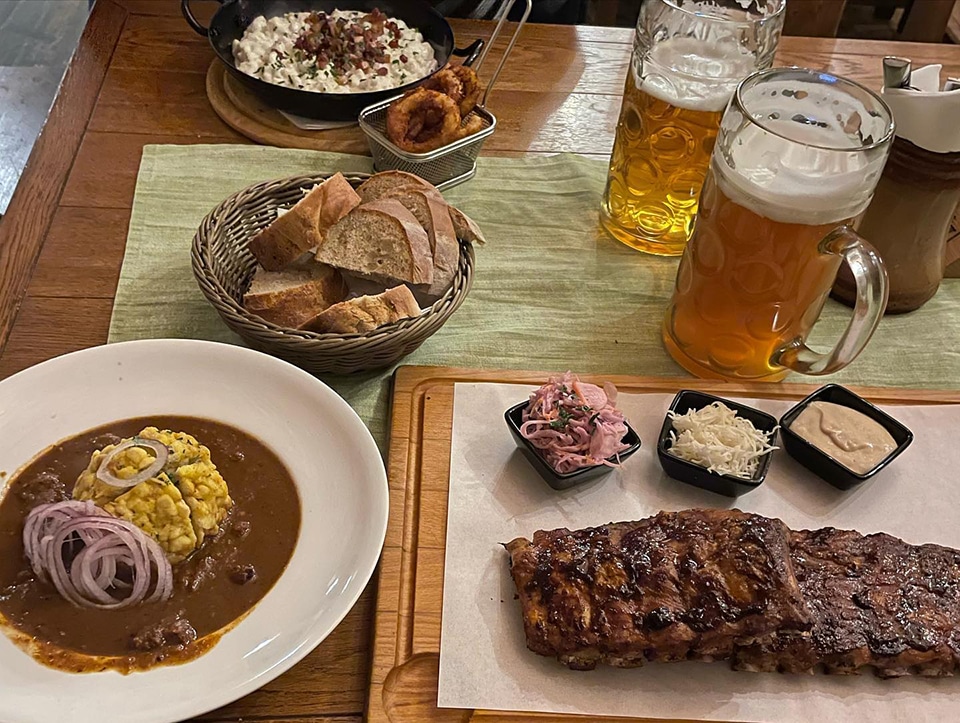 Sample some delicious local food and beer at Sladovňa - House Of Beer, Bratislava.